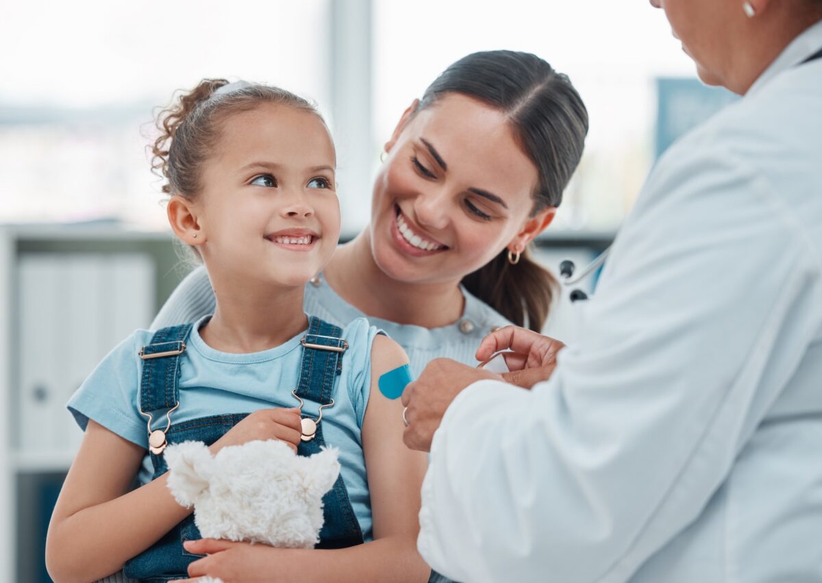 Girl, mom and doctor with vflu accine injection, cotton ball and flu shot on arm